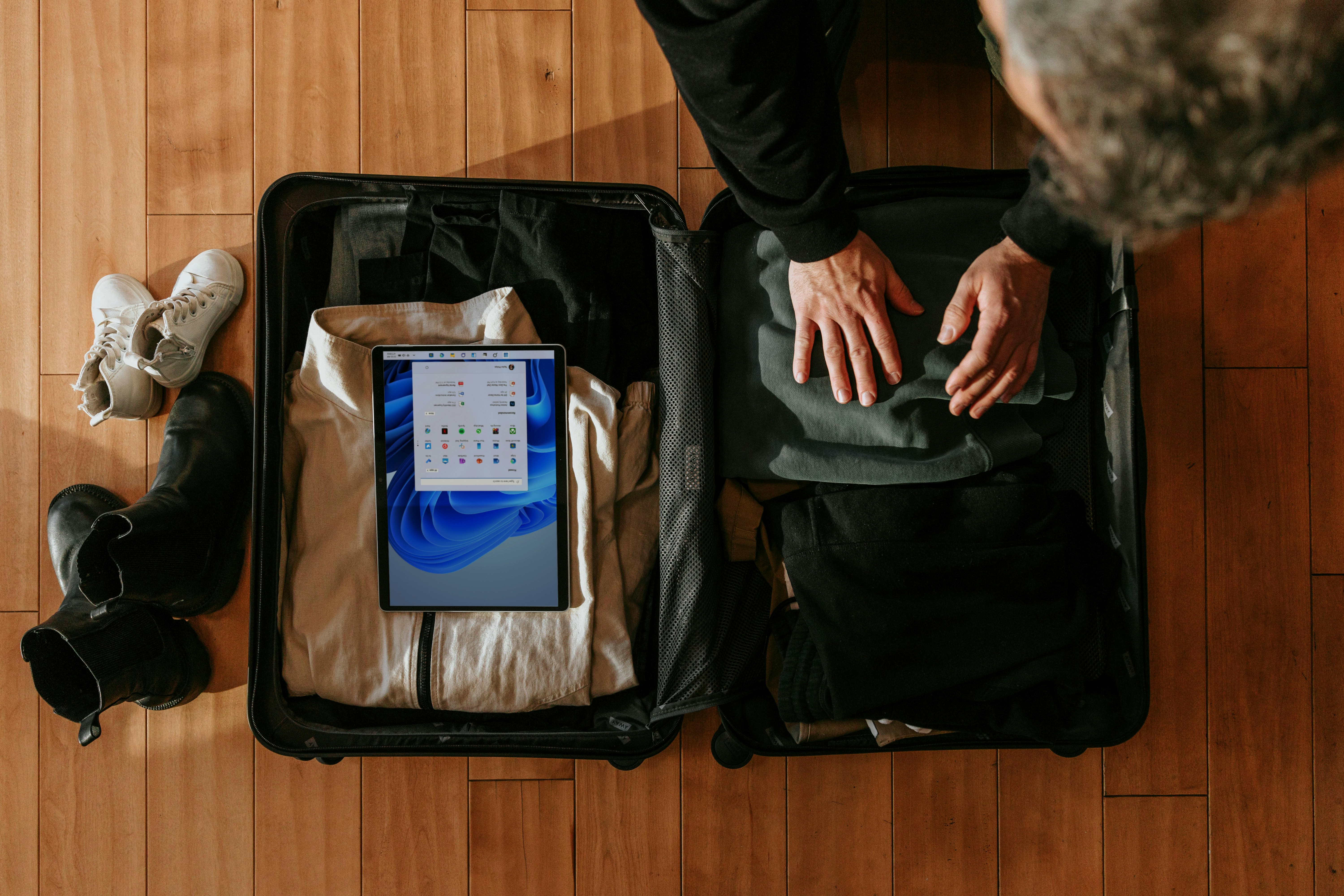 man with travel insurance packing for a trip to northwest florida