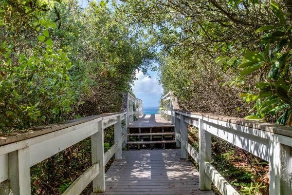 View of wooden pathway that leads to the beach